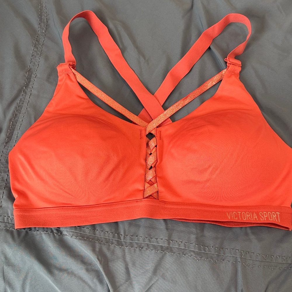 Victoria’s Secret Coral Strappy Padded Sports Bra, size 36C, NWOT.